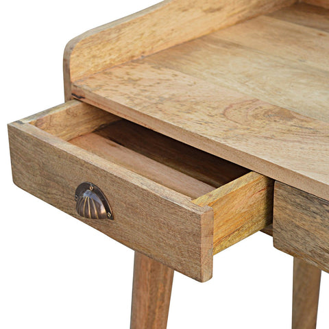 Light-colored wooden side table with a single drawer and brass shell-shaped handle from gallery back shell writing desk