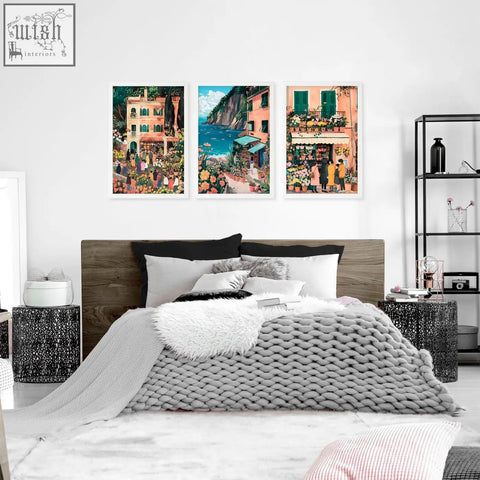 Gray knitted throw blanket with chunky textured weave draped over bed in gallery wall frames italian lifestyle room