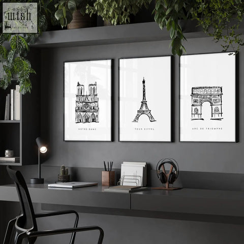 Three framed black and white paris landmarks wall art prints of notre dame eiffel tower and arc de triomphe on dark wall