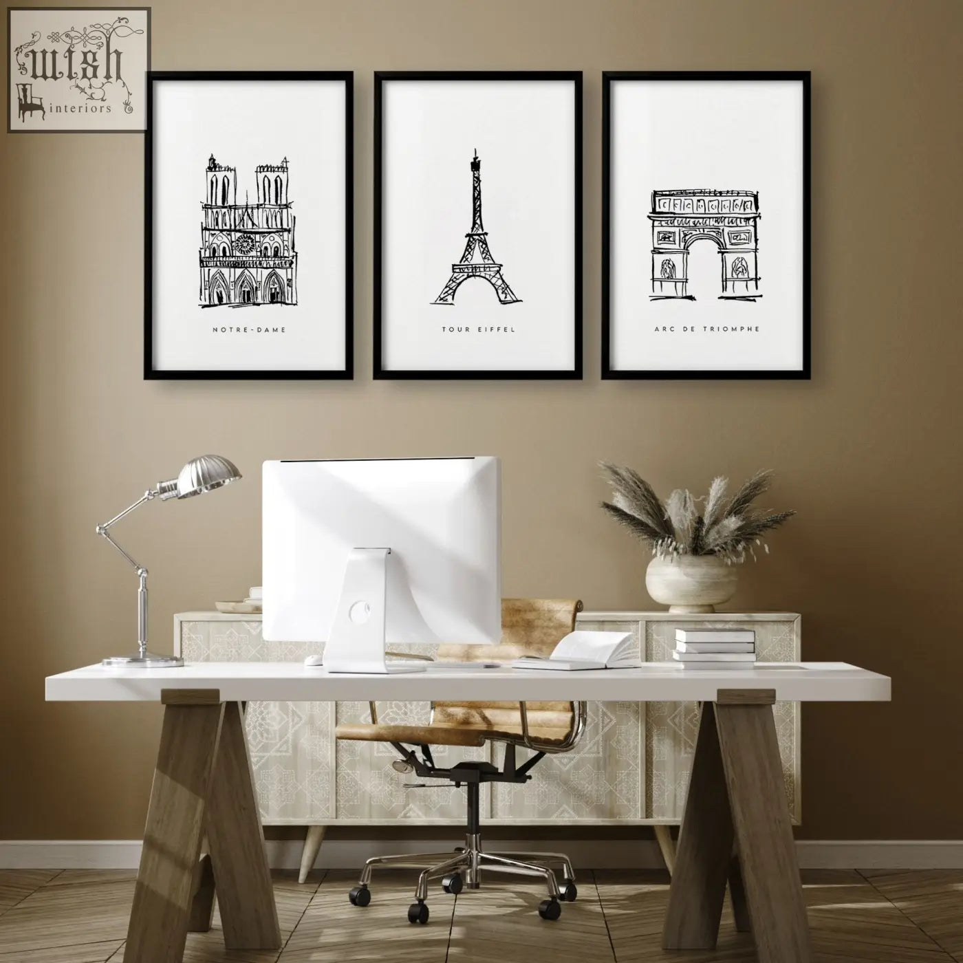 Three framed black-and-white line art prints of paris landmarks wall art featuring notre dame eiffel tower and arc de triomphe above a desk