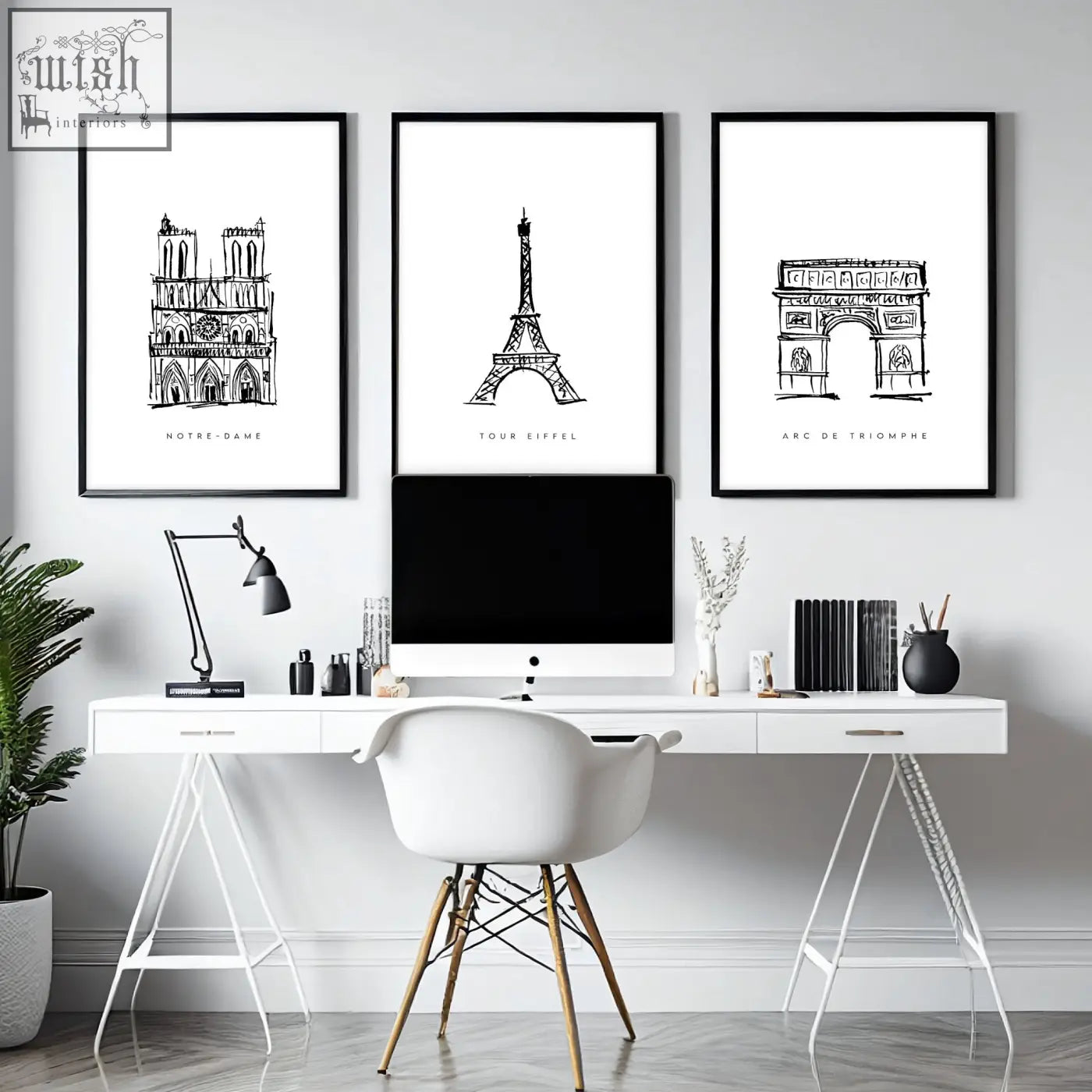 Three framed black-and-white paris landmarks wall art prints hang above a white desk in a gallery wall framing set