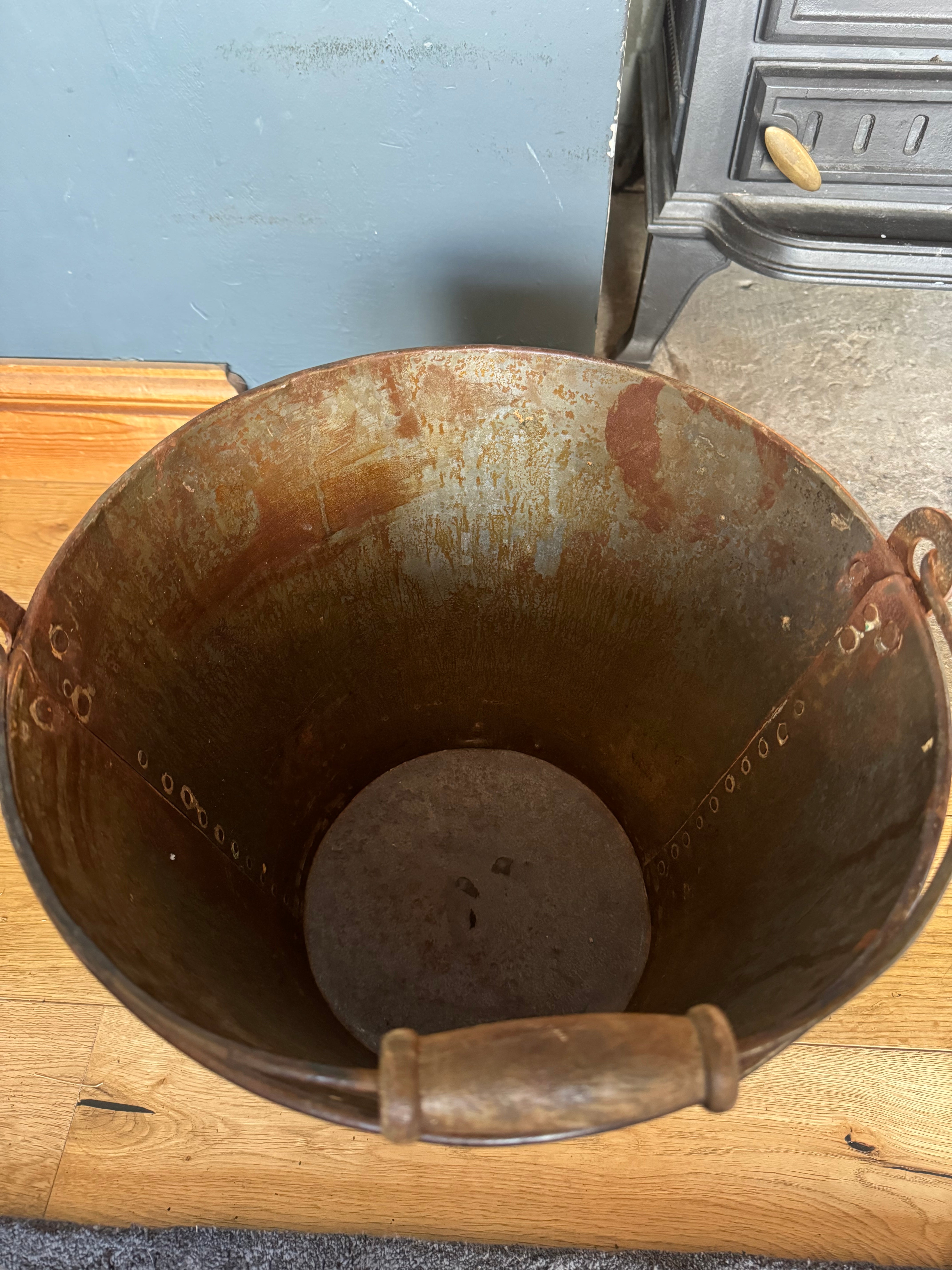 Rusty metal galvanised log basket with wooden handle ideal for christmas tree planter or patio pail use