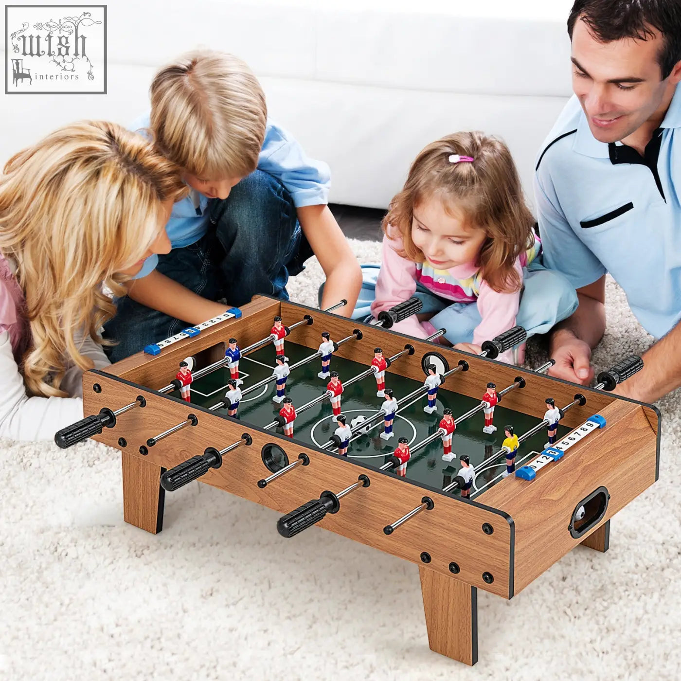 Wooden football table with black handles and red white and blue players perfect for game room or table football fun