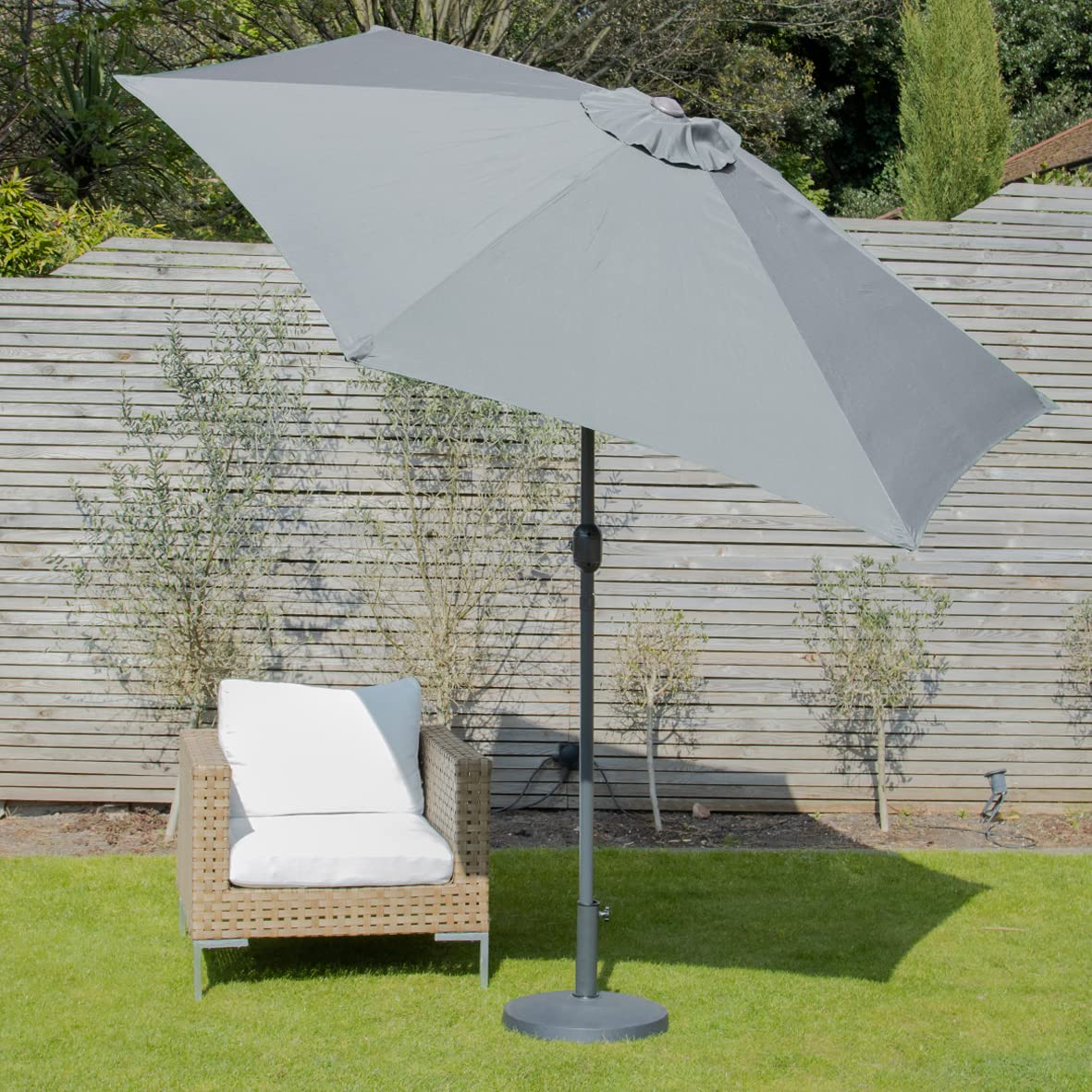 Gray garden parasol with crank mechanism and steel ribs made of durable polyester for outdoor use by GardenKraft