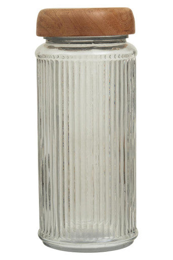 Clear glass storage jar with vertical ridges and natural mango wood lid for kitchen organization
