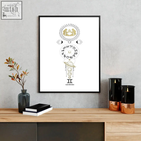 Black-framed gemini zodiac wall art print with gold celestial illustrations on white background for home decor