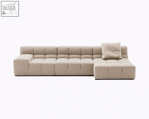 Beige gemma three seater modular sofa with tufted linen velvet cushioned blocks and matching throw pillow