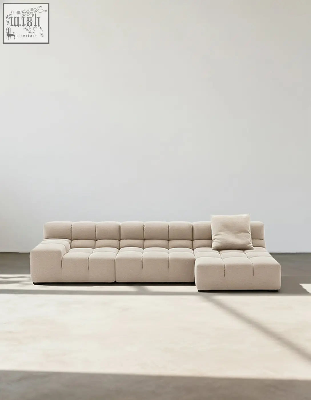Beige gemma three seater modular sofa with tufted cube cushions and one matching throw pillow in linen velvet