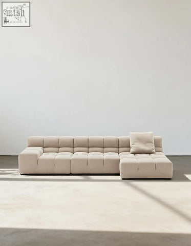 Beige gemma three seater modular sofa with tufted cube cushions and one matching throw pillow in linen velvet