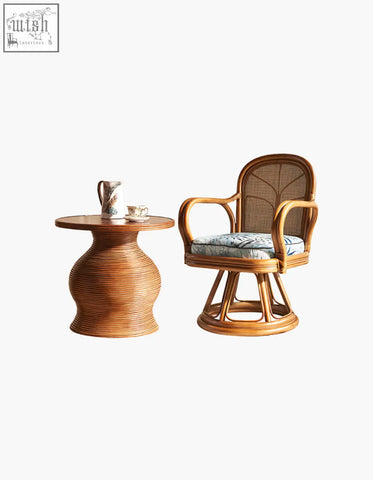 Gentry swivel rattan lounge chair with curved wooden frame and light blue patterned cushion perfect for cozy seating