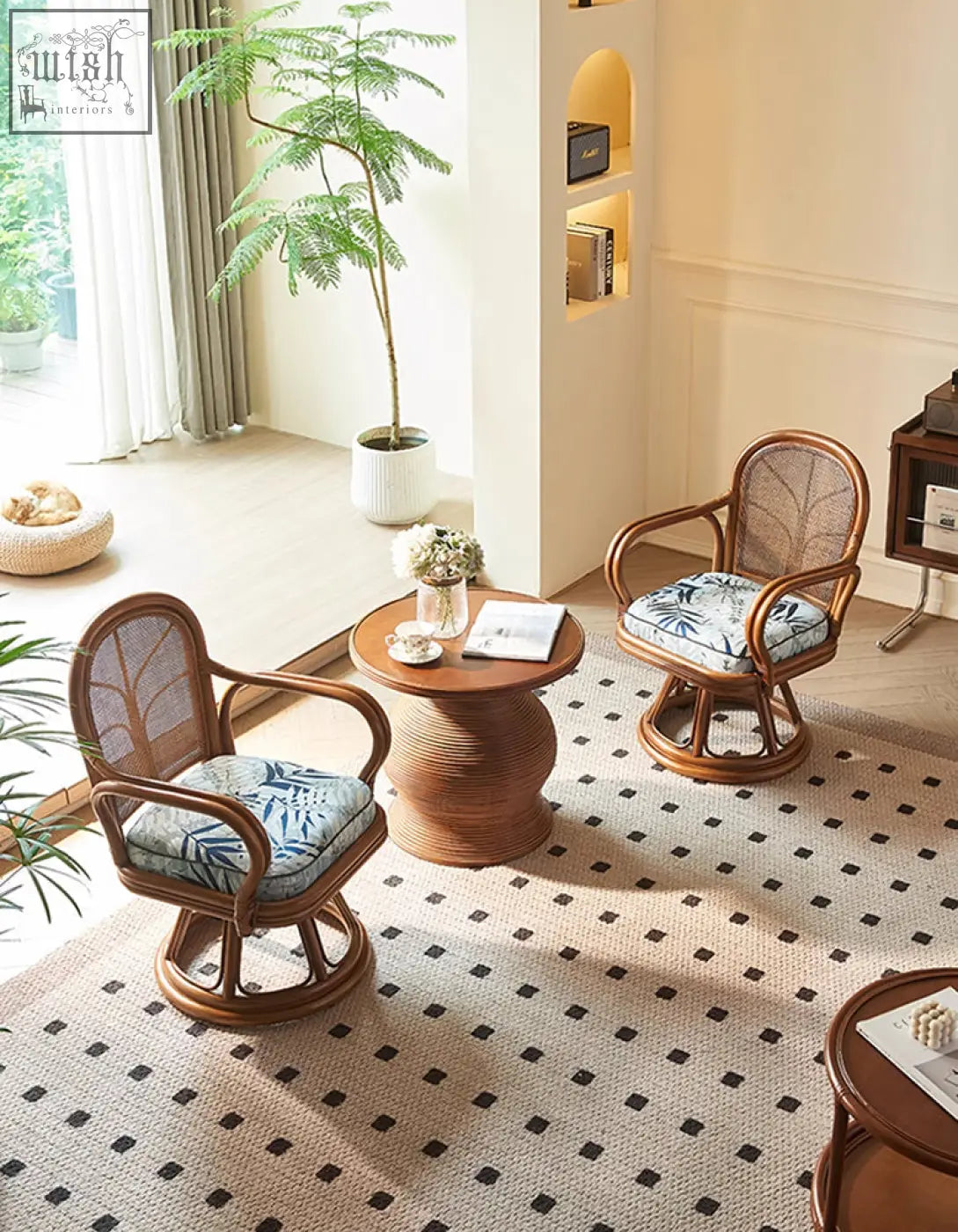 Pair of gentry swivel rattan wooden armchairs with woven backrests and blue leaf-patterned cushions perfect for lounge use