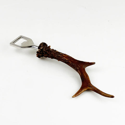 Genuine roe antler bottle opener with polished silver metal cap and natural brown textured roe antler handle