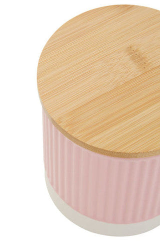 Pink ribbed ceramic jar with natural wood lid from geome pink 550ml storage canister collection