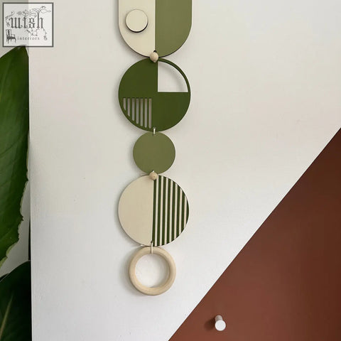 Olive and cream modern wall art with geometric discs and wooden beads made of sustainable plywood for minimal home decor