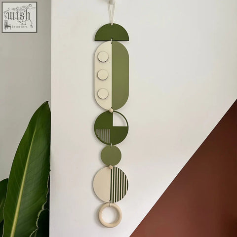 Olive and cream geometric modern wall art with circular wooden pieces made from sustainable plywood for minimalist decor