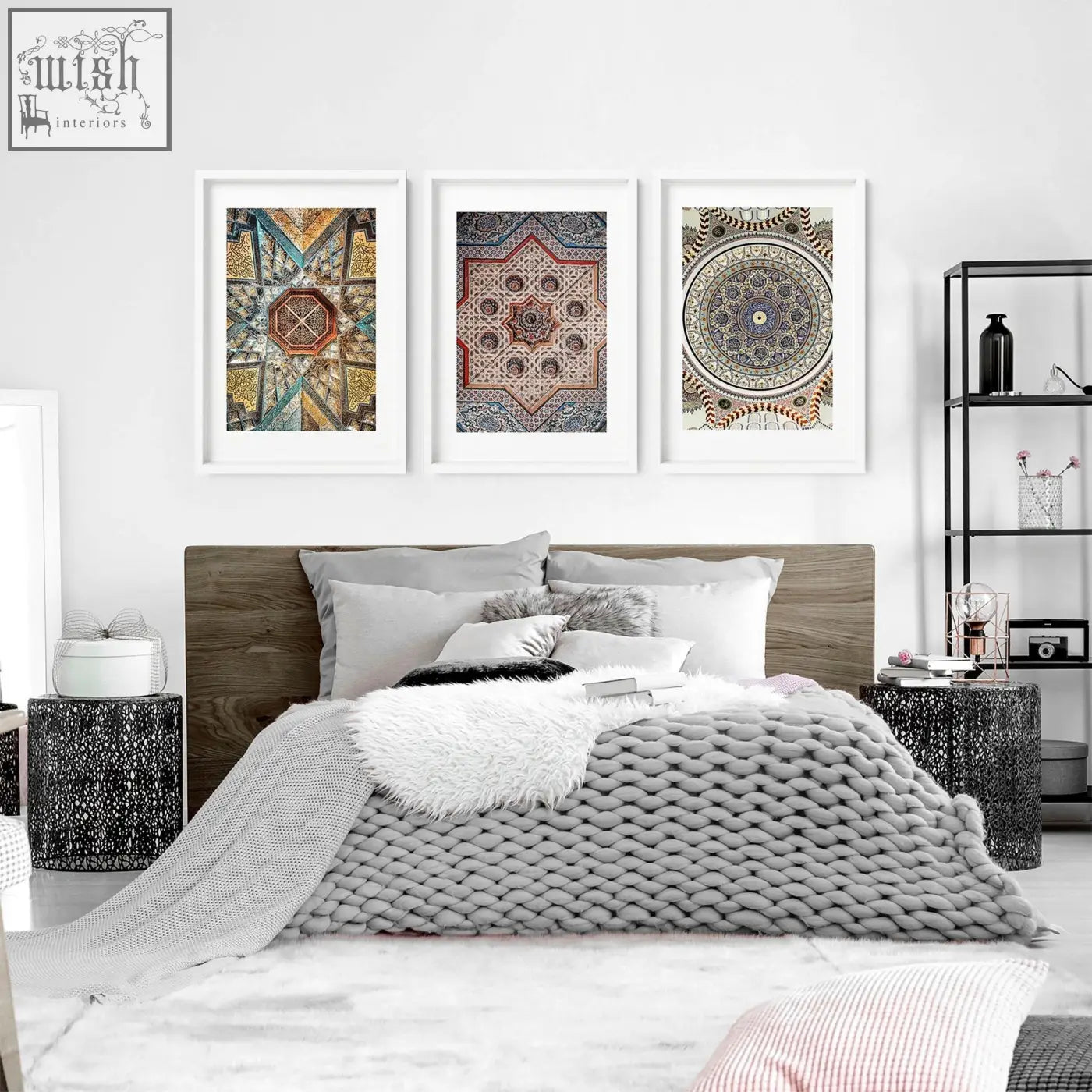 Gray knitted throw blanket with chunky weave draped on bed next to geometric patterns art prints for bedroom walls