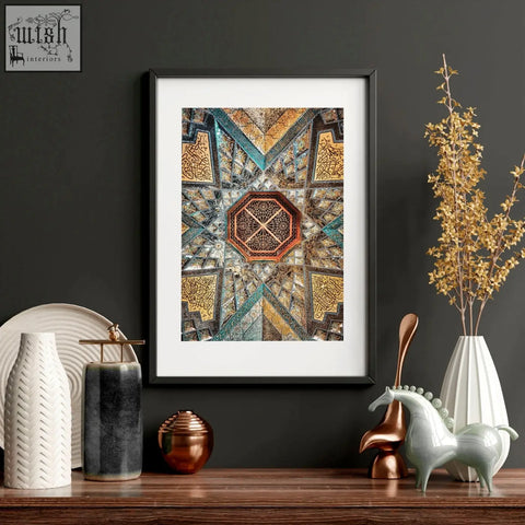 Framed art print featuring geometric patterns with a central orange octagon and gold teal motifs perfect for bedroom walls