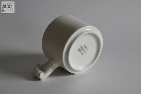 Gesture ceramic cup 4am product design handmade white porcelain coffee cup with smooth glossy finish and rounded handle