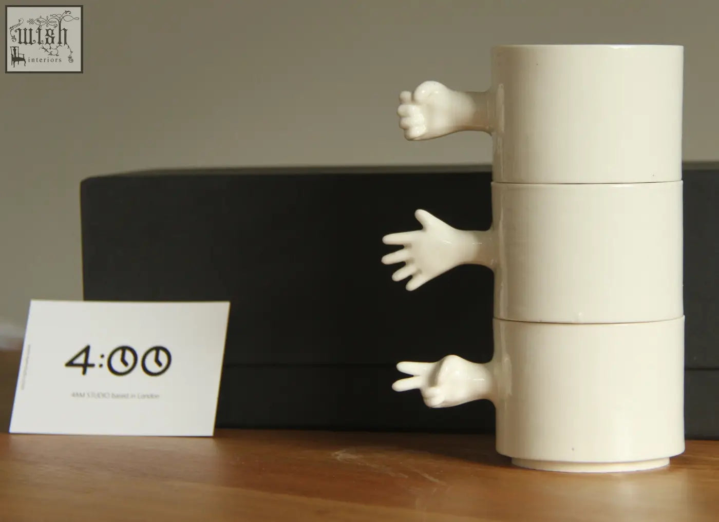 White ceramic stacking mug with sculpted hands from gesture ceramic cups set handmade porcelain by 4am product design
