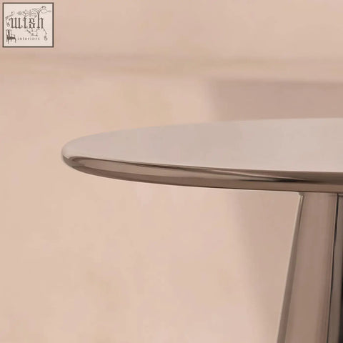 Close up of ghosh side table with shiny chrome finished stainless steel rounded edge profile