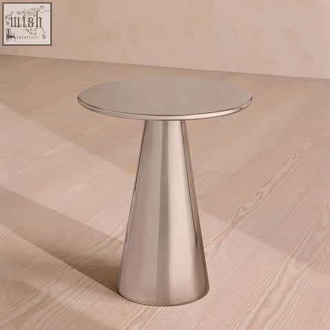A sleek minimalist ghosh side table in polished stainless steel with a conical base and chrome finish