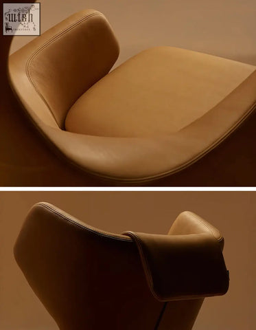 Tan leather ghoshal egg chair wingback lounge chair with sleek modern curves and subtle stitching details with recliner