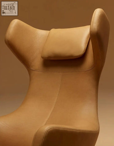 Tan leather ghoshal egg chair lounge chair with sleek modern wingback design integrated headrest and recliner