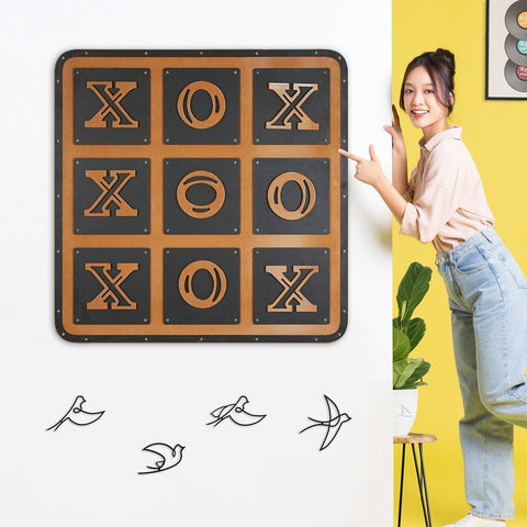 A rustic metal tic tac toe wall art with black and bronze finish featuring bold x’s and o’s in a giant xox board grid