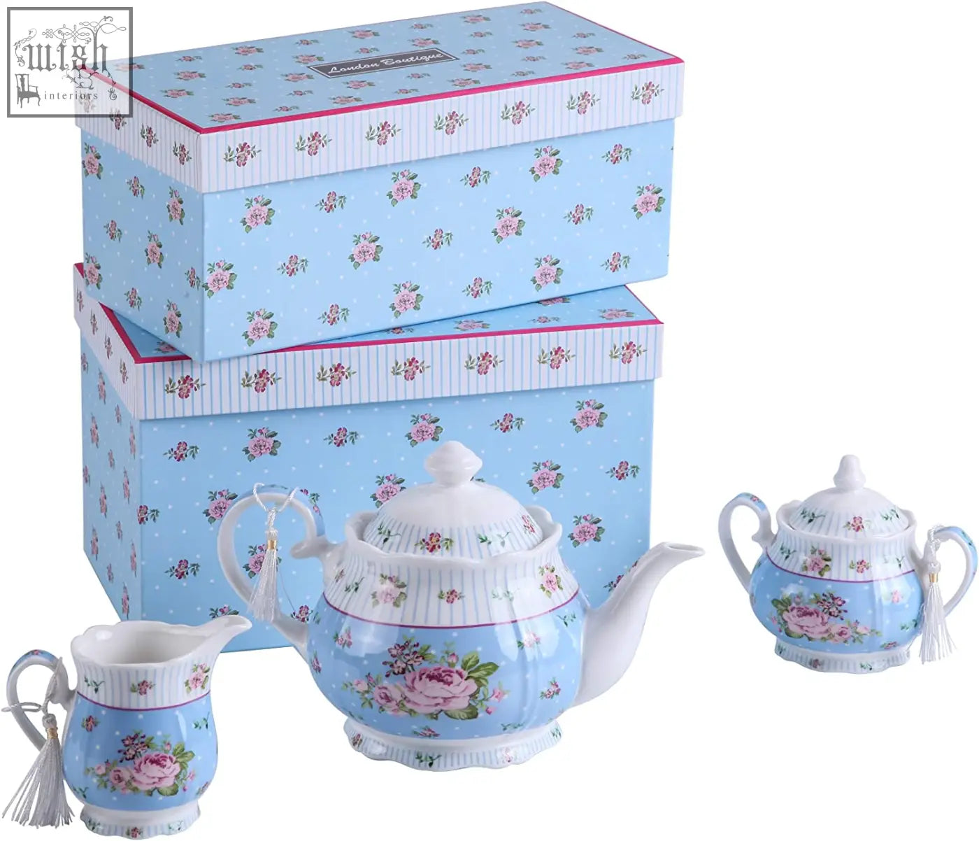 Light blue porcelain tea set with pink rose pattern includes milk jug and tier cake stand for coronation family party