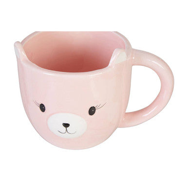 Pink ceramic gigil bear mug shaped like a bear face with black eyes white nose and whiskers perfect for cozy drinks