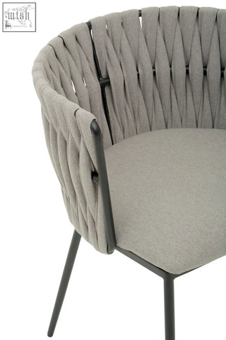 Gilden grey dining chair with woven gray fabric back cushioned seat and sleek black metal frame for dining use