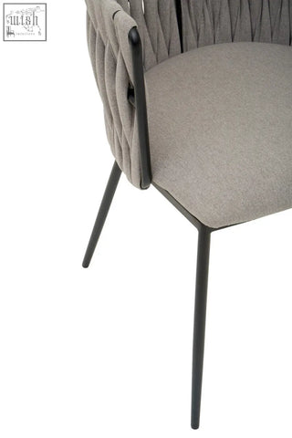 Gilden grey dining chair with textured woven fabric back and black metal legs perfect for grey dining setups
