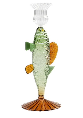 Ginny’s glass bass candle holder is a translucent green and amber glass fish candlestick with a clear fluted top