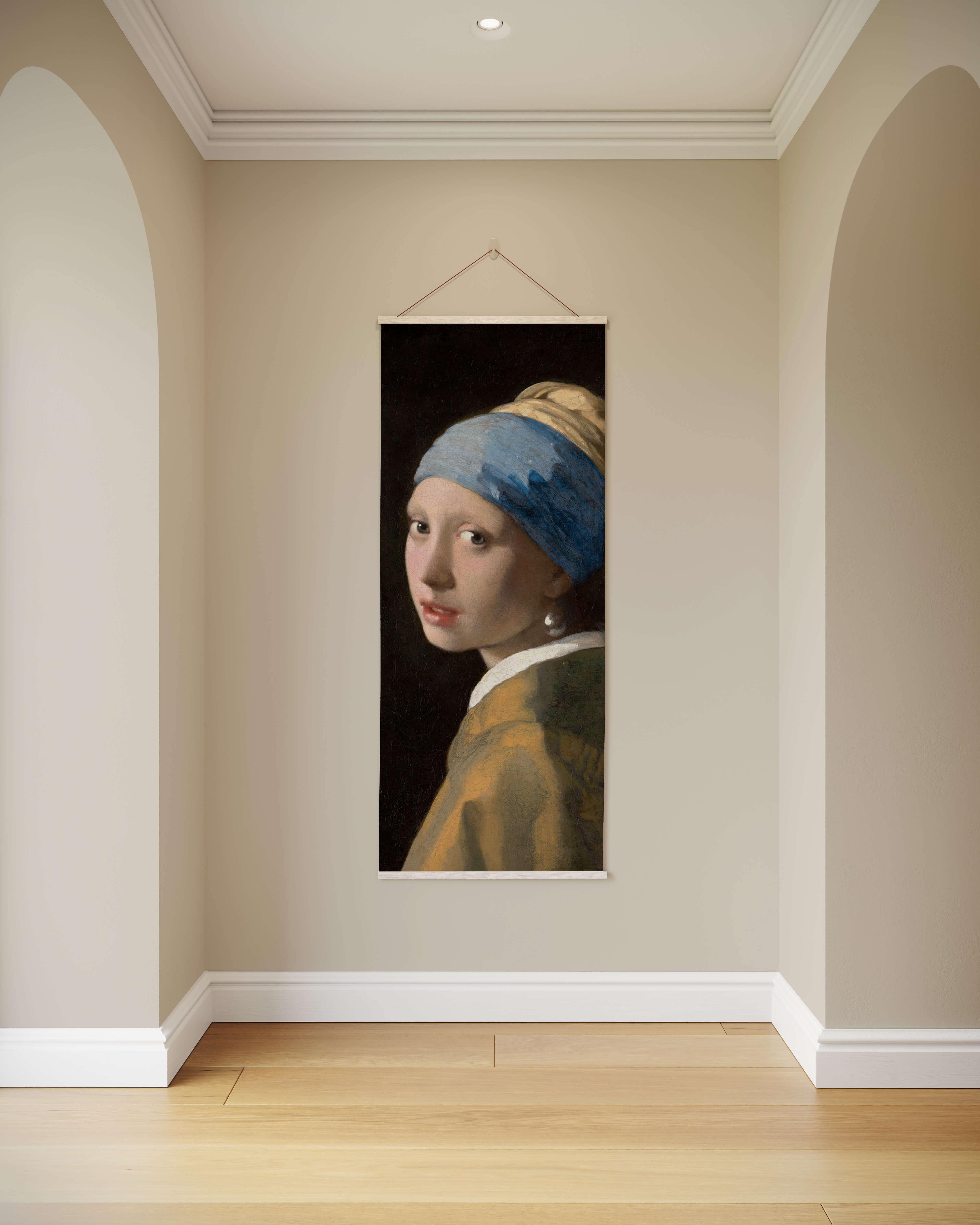 A framed pearl earring tapestry featuring vermeer girl with a pearl earring in blue headscarf and yellow garment