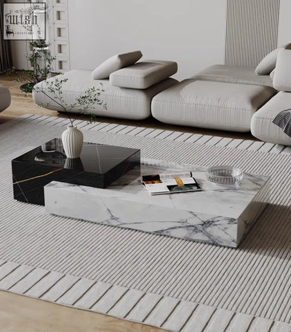 Modern rectangular giuli marble coffee table with white marble top black glossy sides and subtle gold veining