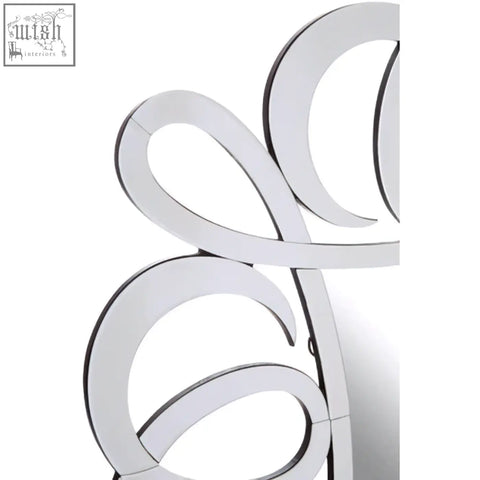 Silver curved wall mirror from the gladis range featuring a sleek modern design perfect for any space