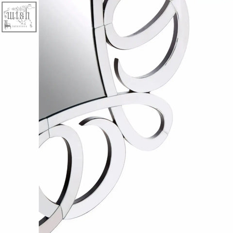 Silver-framed gladis wall mirror with ornate swirling design perfect for elegant wall mirror decor