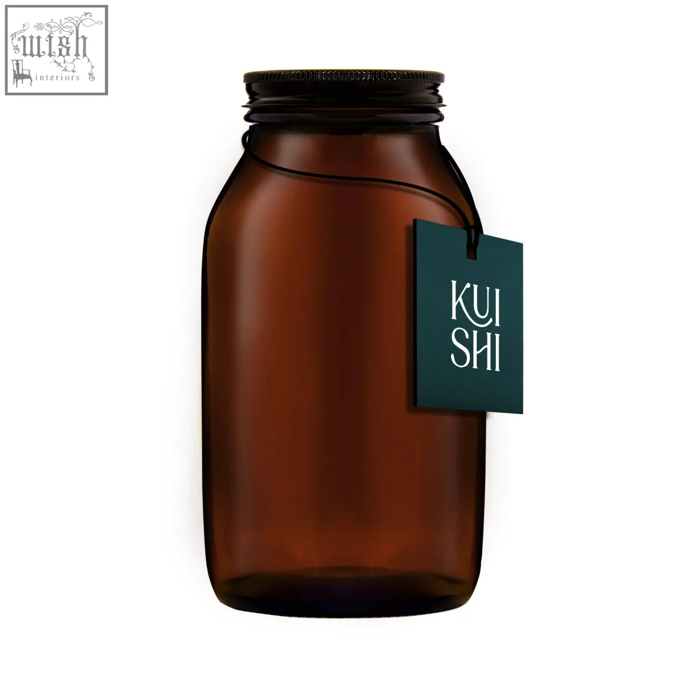 A dark amber glass storage jar with a metallic screw-top lid and a teal kui shi logo tag