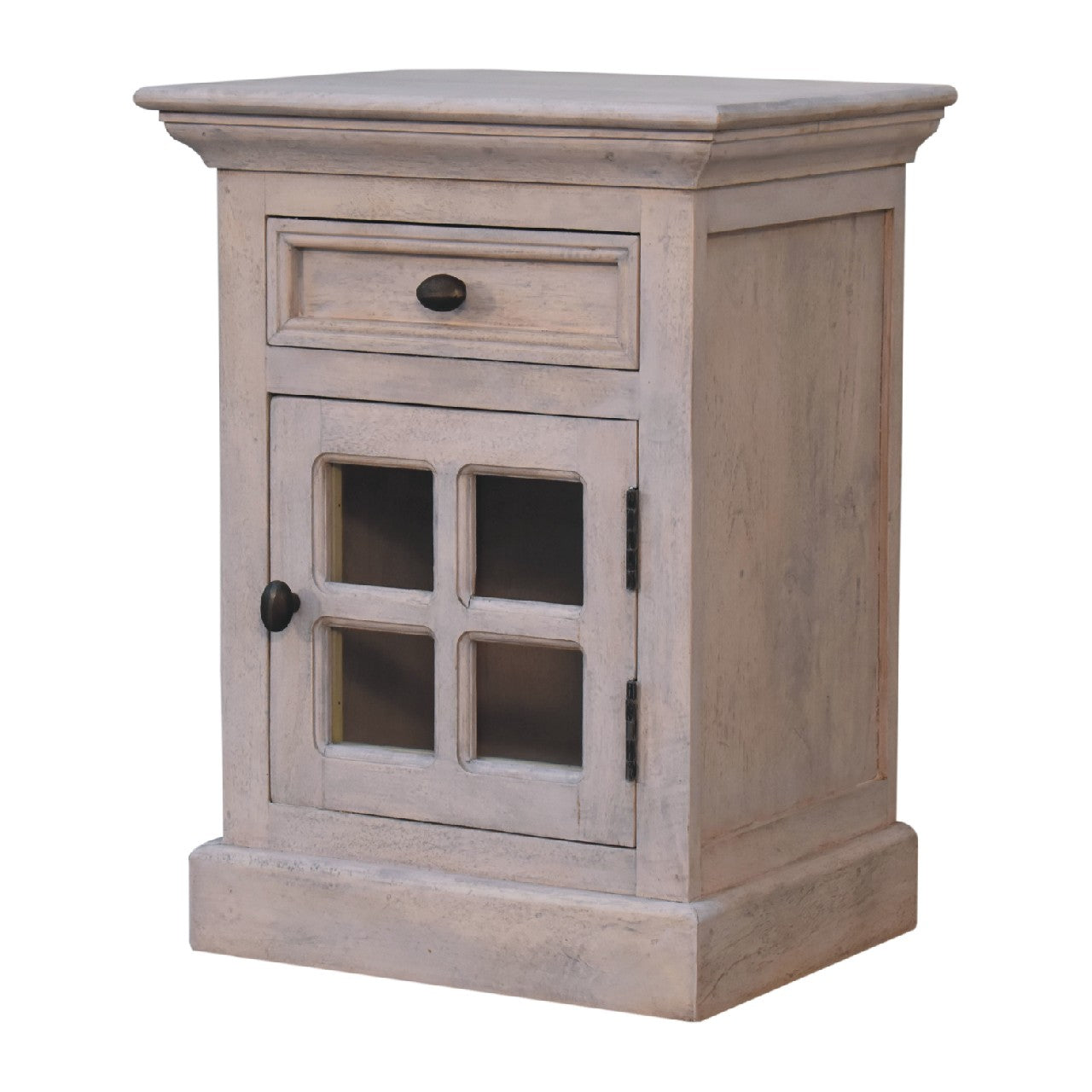 A rustic light gray distressed wood glazed stone bedside table with one drawer and a glass-paneled door