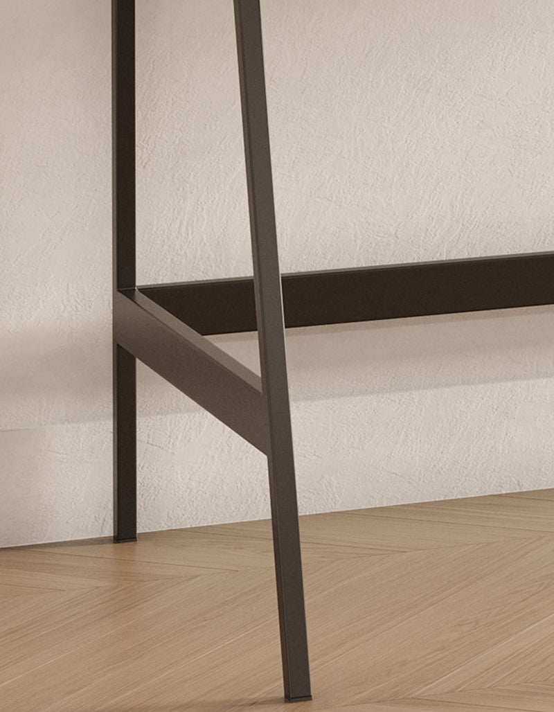 Dark matte-finished metal frame of a modern minimalist glazier dressing table with mirror for stylish bedroom use