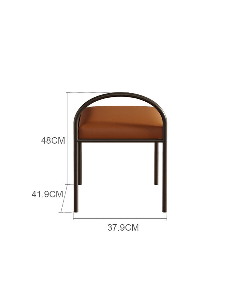 A modern minimalist stool with black metal frame and brown leather seat for glazier dressing table setup