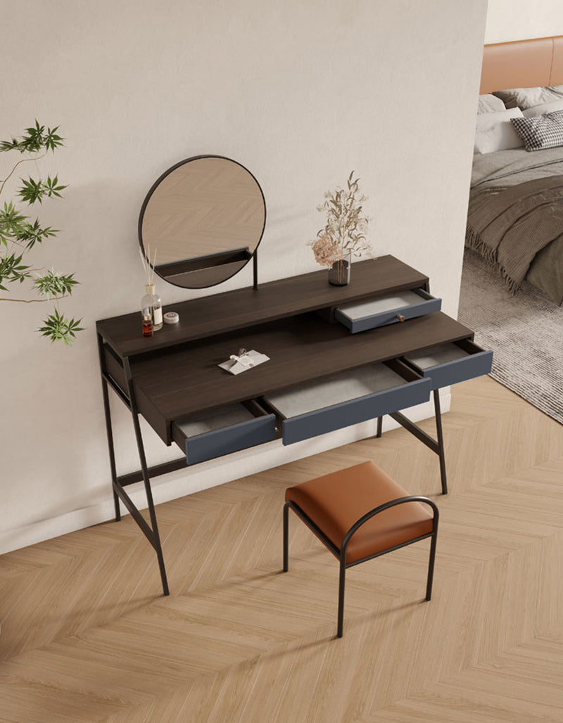 Modern glazier dressing table with dark wood top navy blue drawers and black metal frame for stylish vanity setup