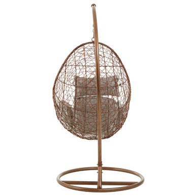 Goa brown rattan hanging chair in bronze wicker egg shape with cushioned interior for cozy relaxation