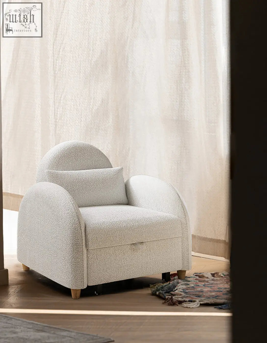 Cozy off-white boucle single sofa bed with rounded arms and matching cushion perfect for a comfy seat
