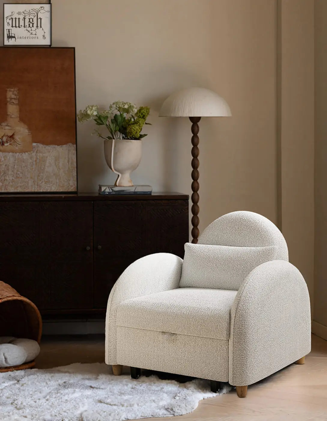 Cream-colored plush single sofa bed in boucle fabric with rounded back perfect cozy seat for small spaces