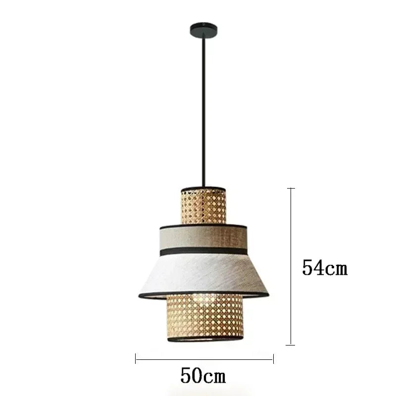 Gokna light tiered pendant light with woven rattan and off-white fabric shades hanging from a black rod