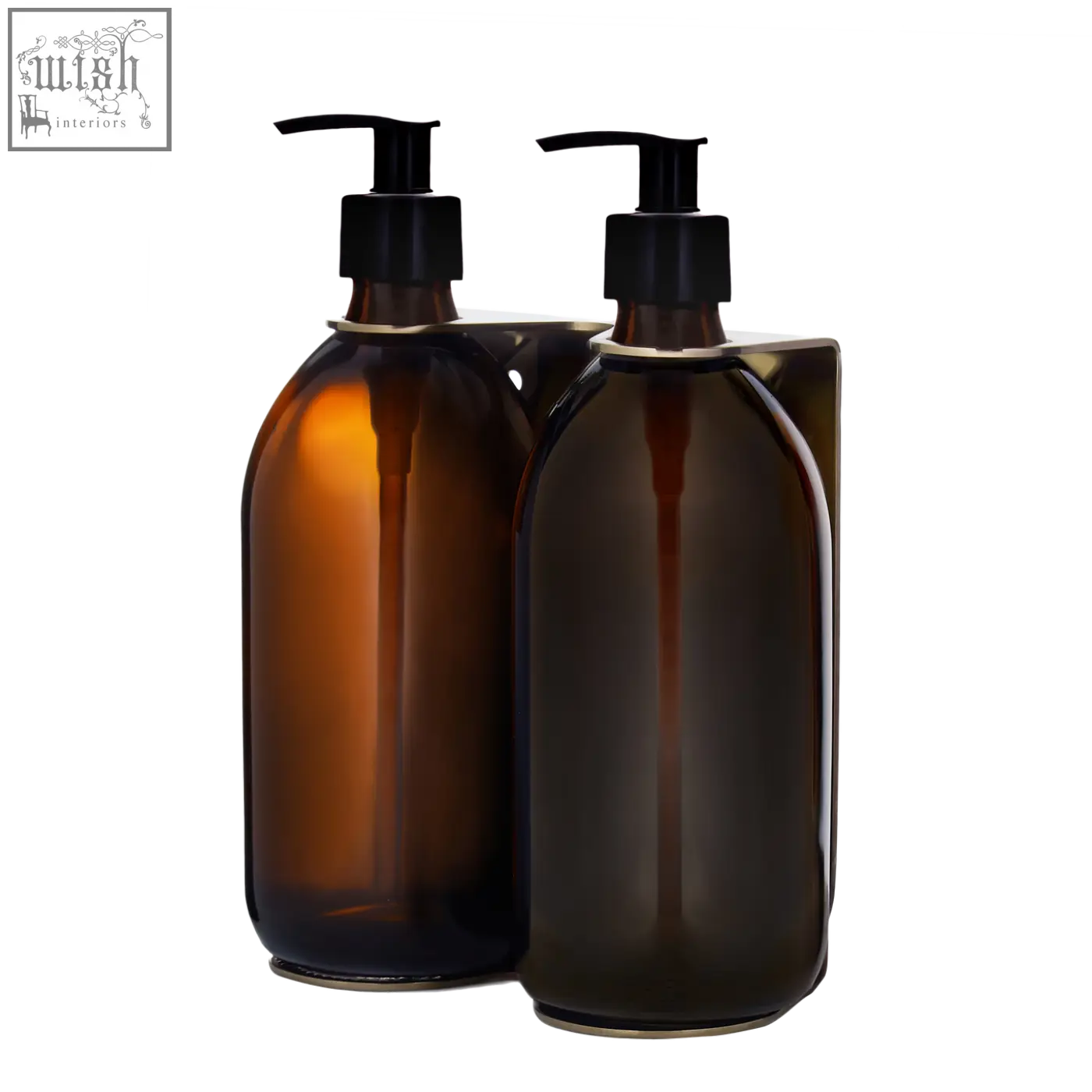 Two refillable glass bottles with black pumps in a gold double wall mounted soap dispenser with stainless steel accents