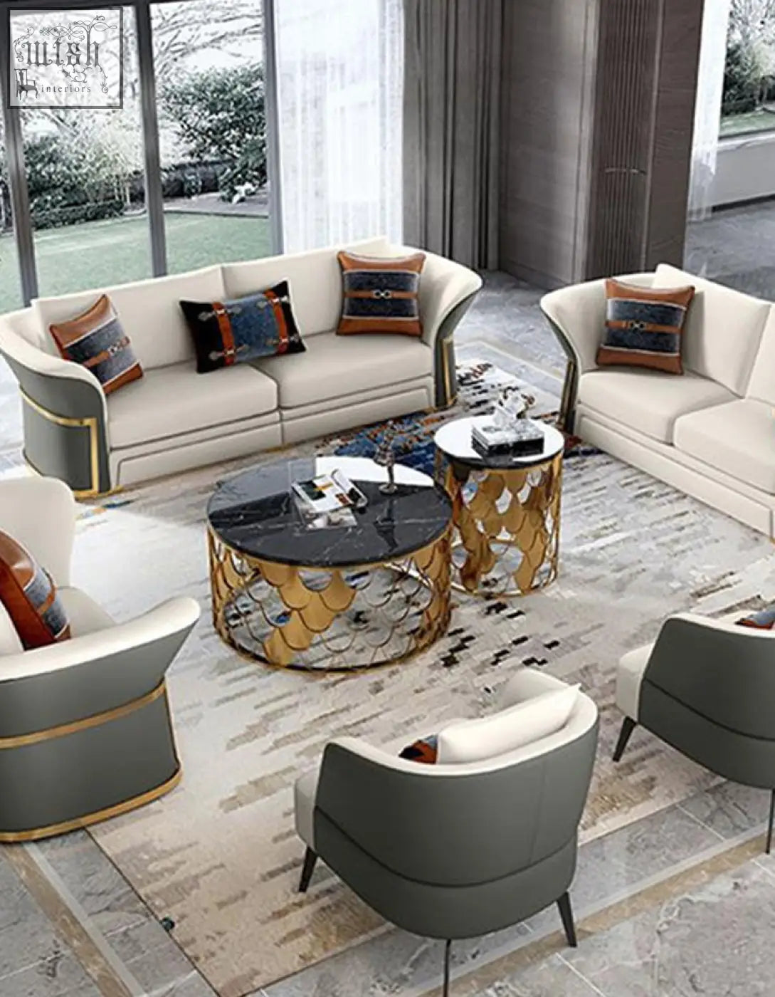 Modern cream and gray upholstered sofa set with gold trim next to a gold nesting coffee table with marble top
