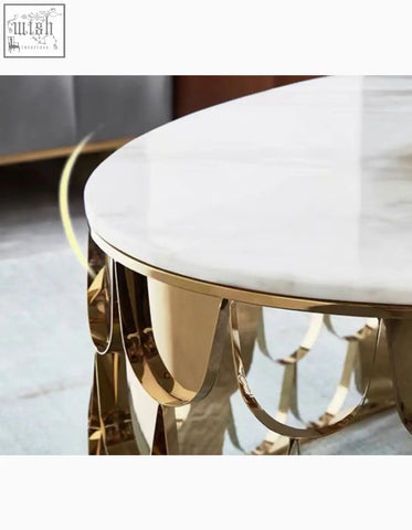 Gold nesting coffee table with polished white marble top and ornate gold metal base featuring sculptural rings