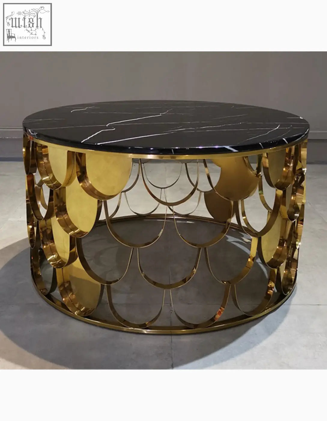 Gold nesting coffee table with a black marble top and gold scalloped fish scale metal base perfect as a coffee table